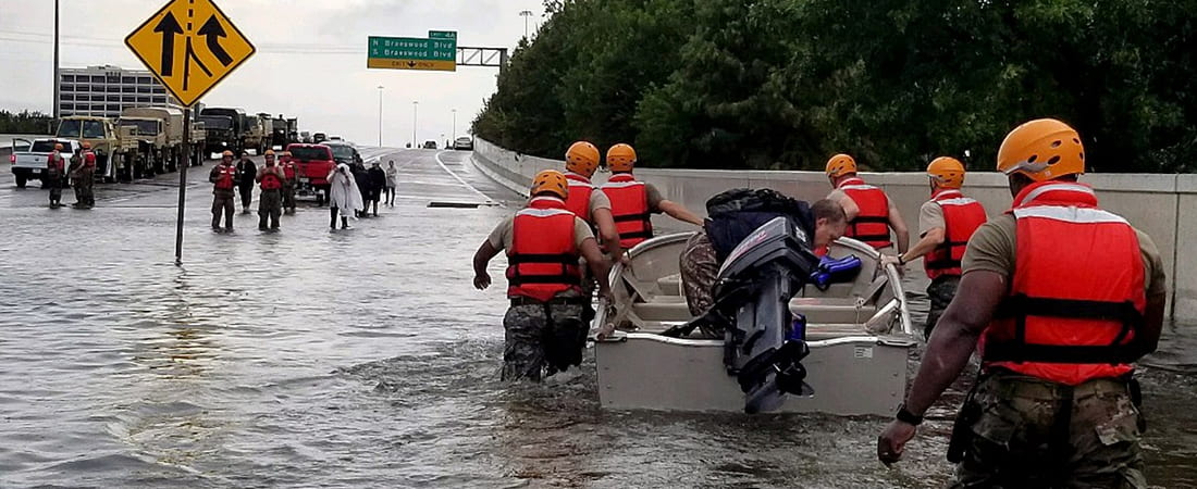 Soldiers with the Texas Army National Guard move through flooded Houston streets as floodwaters from Hurricane Harvey continue to rise, Monday, August 28, 2017. More than 12,000 members of the Texas National Guard have been called out to support local authorities in response to the storm. (U.S. Army photo by 1st Lt. Zachary West)
